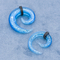 L'oreille matérielle acrylique branche des tunnels se développent en spirales couleur bleue brillante avec les cercles en cuir